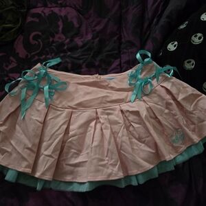 Dolls Kill Pink Mini Skirt with Teal Bows